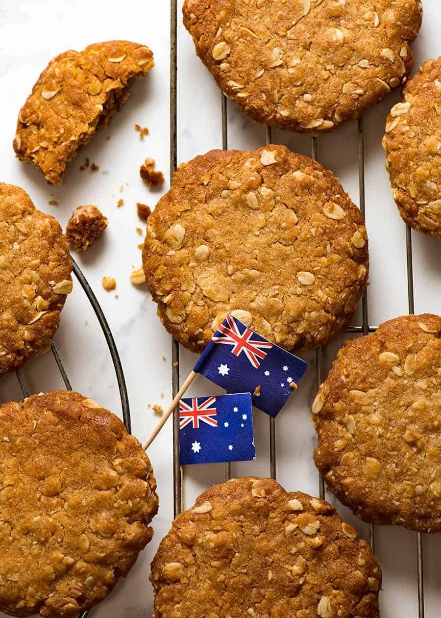 Overhead photo of Anzac biscuits on a cooling rack, fresh out of the oven