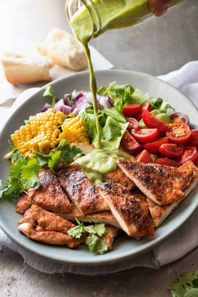 Chicken Salad with Avocado Dressing, with corn, tomatoes, onion and lettuce.