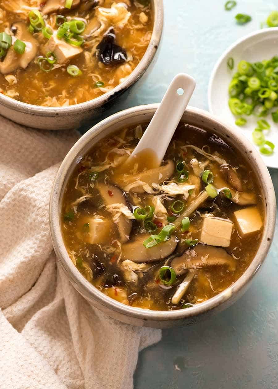 Overhead photo of 2 bowls of Hot and Sour Soup, ready to be eaten